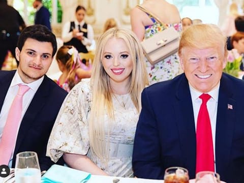 Trump and his daughter and her boyfriend Michael Boulos during dinner