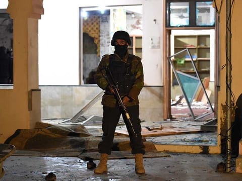 A soldier stands guard at the premises of a mosque after a bomb blast in Quetta.