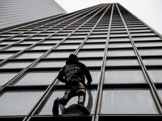 French 'Spiderman' stages protest climb against pension reform