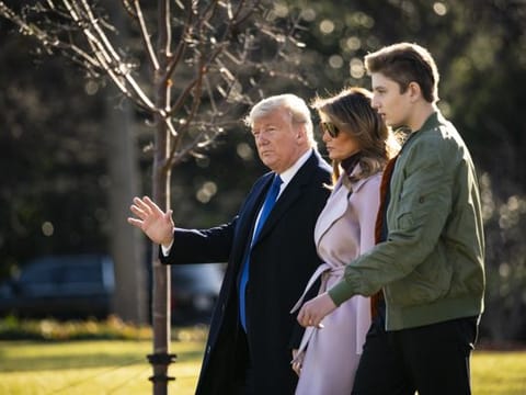 U.S. President Donald Trump, First Lady Melania Trump, and son Barron Trump walk to board Marine One on the South Lawn of the White House in Washington, D.C., on Friday. Trump has named constitutional lawyer Alan Dershowitz to present arguments for his acquittal in his Senate impeachment trial.
