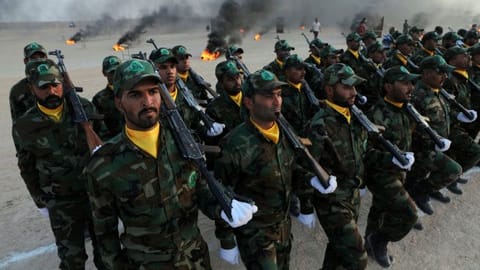 Members of the paramilitary Popular Mobilisation Forces (PMF) take part in their graduation ceremony at a military camp in Kerbala, Iraq 