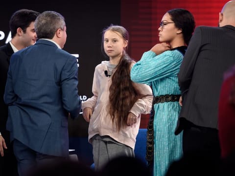 Swedish climate activist Greta Thunberg and Canadian climate and environmental activist Autumn Peltier (C, right) attend a session at the Congres center during the World Economic Forum (WEF) annual meeting in Davos, on January 21, 2020.