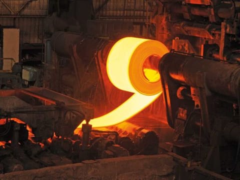 Molten steel rolls at a factory in India. The country’s manufacturing and services sectors are showing signs of recovery after a slowdown 