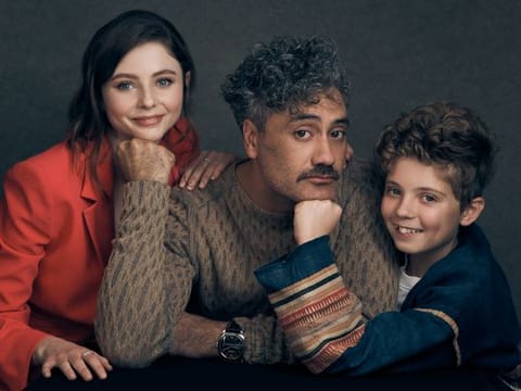   Taika Waititi, centre, with actors Roman Griffin Davis and Thomasin McKenzie.