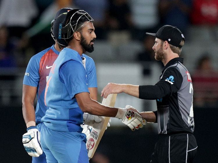India’s Lokesh Rahul (L) speaks to New Zealand’s captain Kane Williamson