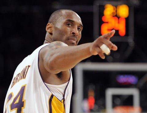 Los Angeles Lakers guard Kobe Bryant (24) points to a player behind him after making a basket in the closing seconds against the Orlando Magic in Game 2 of the NBA basketball finals, in Los Angeles. Bryant, the 18-time NBA All-Star who won five championships and became one of the greatest basketball players of his generation during a 20-year career with the Los Angeles Lakers, died in a helicopter crash Sunday, Jan. 26, 2020.