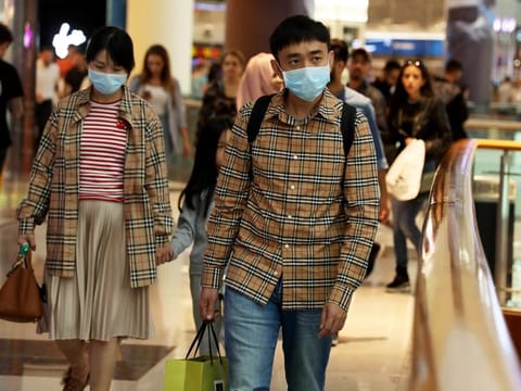 Due to recent threats of the Coronavirus, Chinese tourists in Dubai Mall wear masks to contain the virus from spreading. Picture taken on 26th January, 2020. 