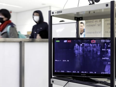 A monitor displays a thermographic image of passengers passing through a quarantine station at Narita Airport in Narita, Chiba Prefecture, Japan, on Thursday, Jan. 23, 2020. Chinese officials moved to halt travel from Wuhan, essentially locking down a city of 11 million people, as they try to stop the spread of a new SARS-like virus that’s already killed 17 and infected hundreds around the world. Photographer: Kiyoshi Ota/Bloomberg
