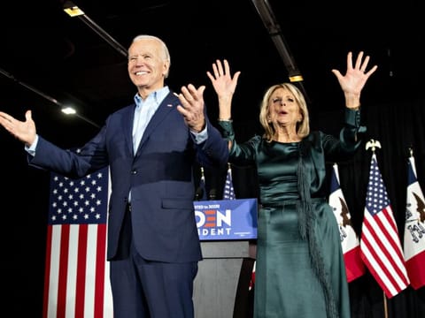 Former US Vice-President Joe Biden, 2020 Democratic presidential candidate, and his wife Jill Biden greet supporters during a caucus night watch party in Des Moines, Iowa on February 3.