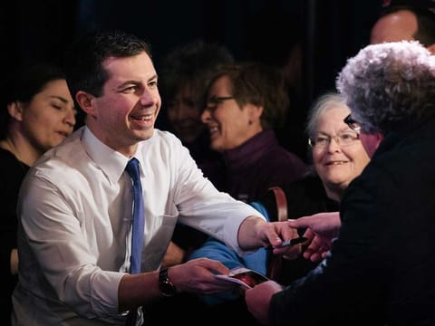Pete Buttigieg greets people during a campaign event in Portsmouth, New Hampshire 