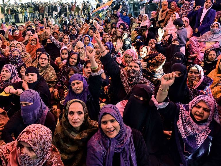 Muslim women shout slogans against India's new citizenship law, during a protest at Shaheen Bagh area  near the Jamia Millia Islamia university in New Delhi on Wednesday.  