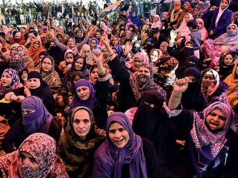 Muslim women shout slogans against India's new citizenship law, during a protest at Shaheen Bagh area  near the Jamia Millia Islamia university in New Delhi. 