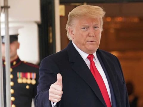 US President Donald Trump gives a thumbs up as he welcomes Venezuela's opposition leader Juan Guaido at the White House after he was acquitted in his Senate impeachment trial in Washington on February 5, 2020. 