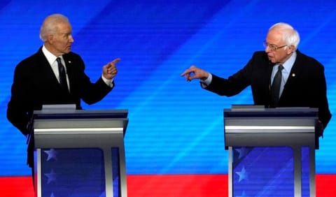 Former Vice-President Joe Biden and Senator Bernie Sanders debate at the Democratic 2020 US presidential candidates debate in Manchester, New Hampshire, on February 7.