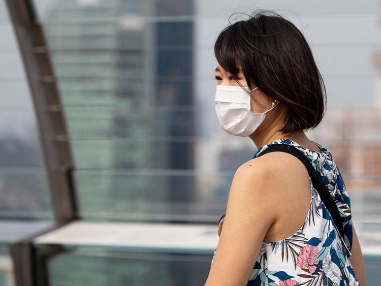 A woman wearing a protective mask