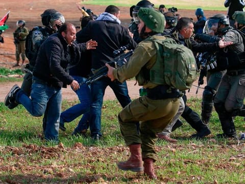 Palestinian protesters clash with Israeli soldiers during a demonstration against a US brokered Middle East peace deal near the West Bank village of Tamun near the Jordan Valley on January 31, 2020. 