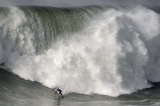 Photos: Surfers brave monster waves of Portugal's Nazare