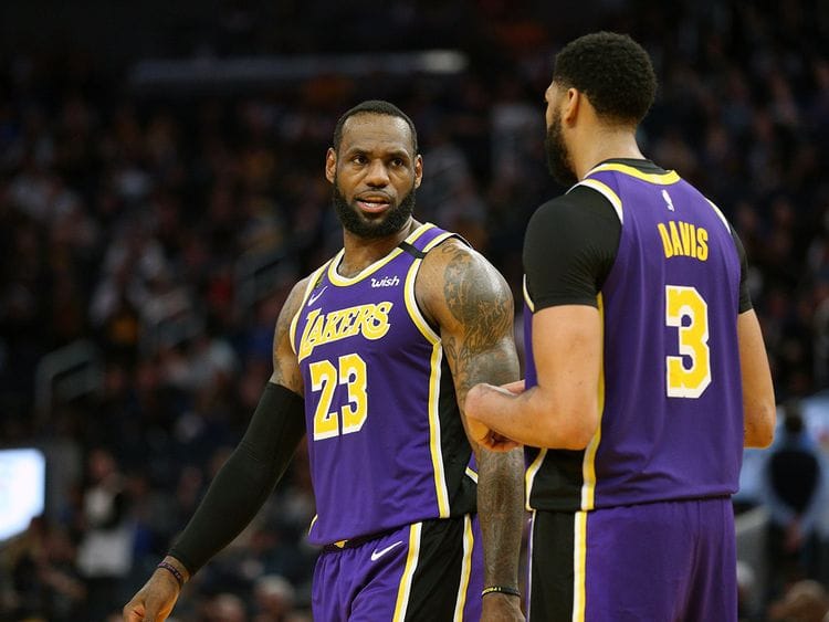 Los Angeles Lakers forward LeBron James (23) talks with center Anthony Davis