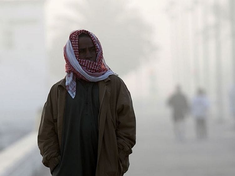 A chilly foggy morning on Jumeirah Open beach in Dubai.