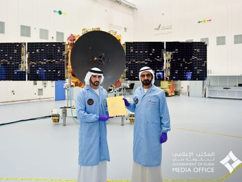 File photo of Sheikh Mohammed bin Rashid Al Maktoum (R) and Sheikh Hamdan bin Mohammed bin Rashid Al Maktoum (L) witnessing installation of the last metal piece of Hope Probe  