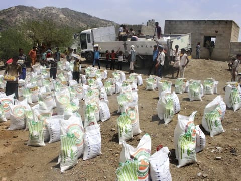 In this  file photo, men deliver aid donations from donors, in Aslam, Hajjah, Yemen. Al Houthis in Yemen have blocked half of the United Nations’ aid delivery programmes in the war-torn country. 
