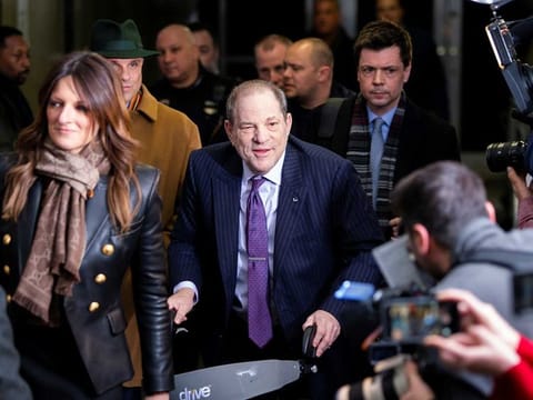 Film producer Harvey Weinstein smiles as he exits the New York Criminal Courtroom with his defense attorneys Donna Rotunno and Damon Cheronis after the second day of jury deliberations in his sexual assault trial in the Manhattan borough of New York City, New York, U.S., February 19, 2020.