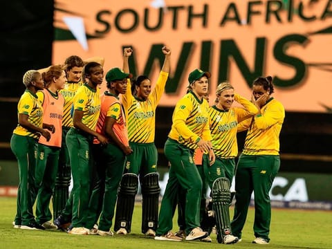 Mignon Du Preez of South Africa (2-R) leads her team in celebration after winning the Twenty20 women's World Cup cricket match against England in Perth on February 23, 2020.  