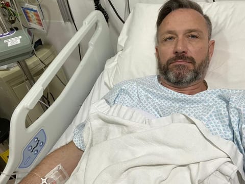 Graham Tooby hospitalised with second degree burns after the lithium battery in his vape machine exploded in his pocket on New Year's Eve