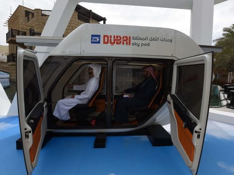 Delegates looking at the Dubai Sky Pod Vehicle which will help shape the future of transportation in Dubai during the World Government Summit  at Madinat Jumeirah on February 10 2019 