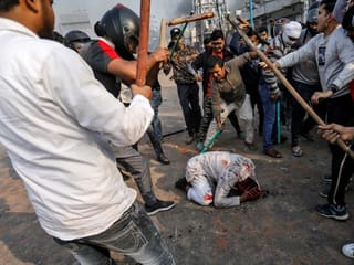 Mob attack on Muslim man in India's capital captured in dramatic photograph