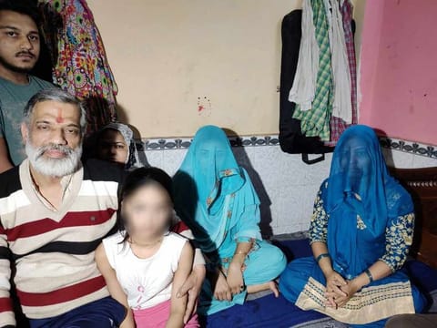 Rajkumar Bhardwaj (L) brought the family to Gautampuri in the early hours on February 25