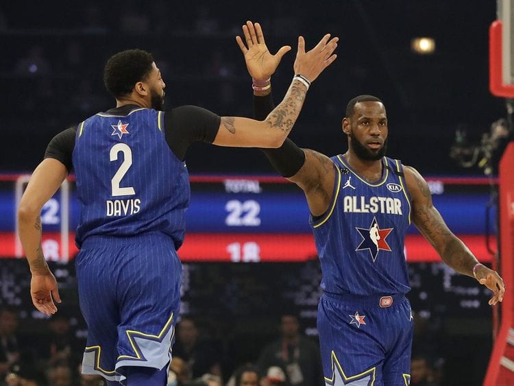 LeBron James of the Los Angeles Lakers high fives Anthony Davis of the Los Angeles Lakers uring the first half of the NBA All-Star basketball game Sunday, Feb. 16, 2020, in Chicago. 