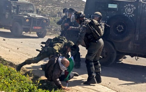 Israeli security forces scuffle with a Palestinian man during clashes following a protest in the village of Baita south of Nablus in the occupied West Bank on February 28, 2020