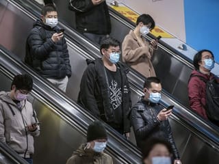 New normal in virus-hit China: High-tech tracking and fever checks