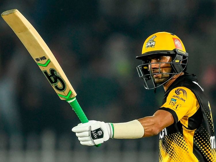 Peshawar Zalmi's Shoaib Malik celebrates after scoring a half century (50 runs) during the Pakistan Super League (PSL) T20 cricket match between Quetta Gladiators and Peshawar Zalmi at the Rawalpindi Cricket Stadium in Rawalpindi.  / AFP / Aamir QURESHI