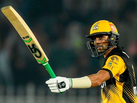 Peshawar Zalmi's Shoaib Malik celebrates after scoring a half-century against Quetta Gladiators at the Rawalpindi Cricket Stadium 