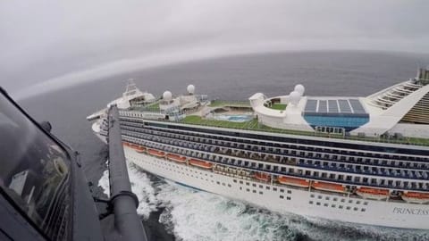 Airmen from the Moffett Federal Airfield based, 129th Rescue Wing deliver coronavirus test-kits to the Grand Princess cruise ship off the coast of California on Thursday.