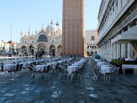 Empty restaurant tables are seen in St. Mark's Square as the Italian government prepares to adopt new measures to contain the spread of coronavirus in Venice, March 8.