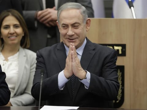 Israeli Prime Minister Benjamin Netanyahu gestures during a meeting with his nationalist allies and his Likud party members at The Knesset - Israeli Parliament in Jerusalem