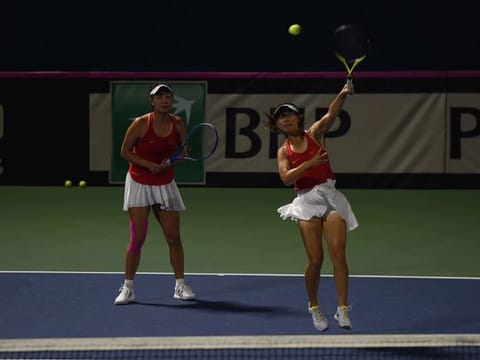 Peng Shuai and Yifan Xu of China in action against Korea during their final Fed Cup group game at Dubai Tennis Stadium on Saturday evening.
