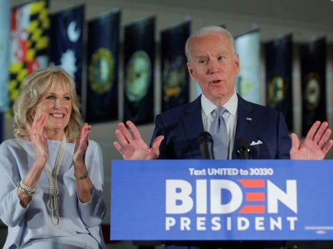 Democratic US presidential candidate and former Vice-President Joe Biden speaks with his wife Jill at his side during a primary night speech at The National Constitution Center in Philadelphia, Pennsylvania, on March 10, 2020.