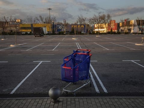 Shopping carts in the middle of an empty parking lot in a shopping area in San Sebastian de los Reyes, outskirts Madrid on March 14.