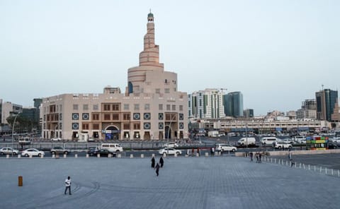 This picture taken on March 16 shows a view of the almost deserted Souq Waqi in Qatar's capital Doha, with the spiral minaret of the mosque at the Abdulla Bin Zaid Al Mahmoud Islamic Cultural Centre seen in the background. 