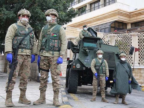 Jordanian soldiers keep watch on March 18, 2020 in the capital Amman as Jordan takes measures to fight the spread of the coronavirus COVID-19.