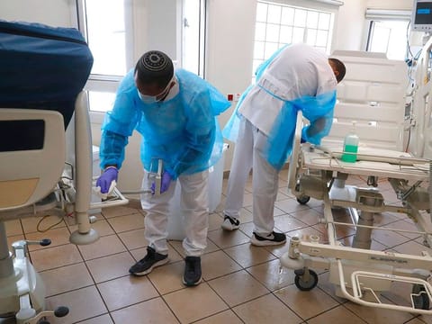 Medical staff from Tel Aviv Sourasky Medical Center (Ichilov), Israel's leading multidisciplinary healthcare institution, clean and disinfect a segment of the hospital which will be dedicated to receiving patients suffering from the novel coronavirus, in the Israeli coastal city of Tel Aviv.   