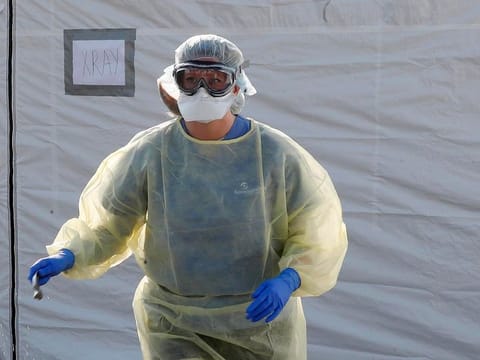 Staff at work at the Samaritan's Purse field hospital that is being set up in Cremona, Italy, Saturday, March 21, 2020.