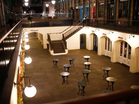 Empty tables are seen in Covent Garden on the day Prime Minister Boris Johnson ordered all venues to close in response to the growing number of coronavirus disease (COVID-19) cases in London, Britain, March 20, 2020.