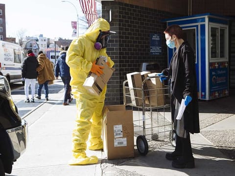 File picture: A person wearing protective clothing and a respirator mask donates protective equipment to the Elmhurst Hospital Center in the Queens borough of New York, US.
