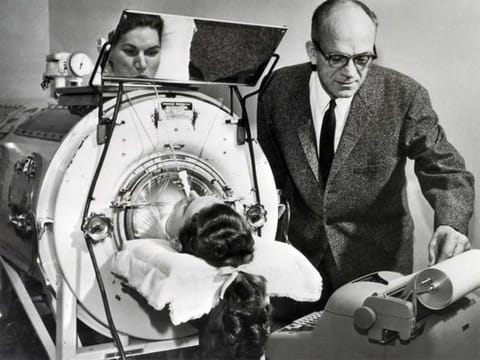 Polio was an ever-present threat for decades. Here, a  victim assisted by an Emerson Respirator, better known as an iron lung. 