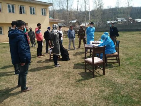 GMC hospital staff check people in Srinagar.